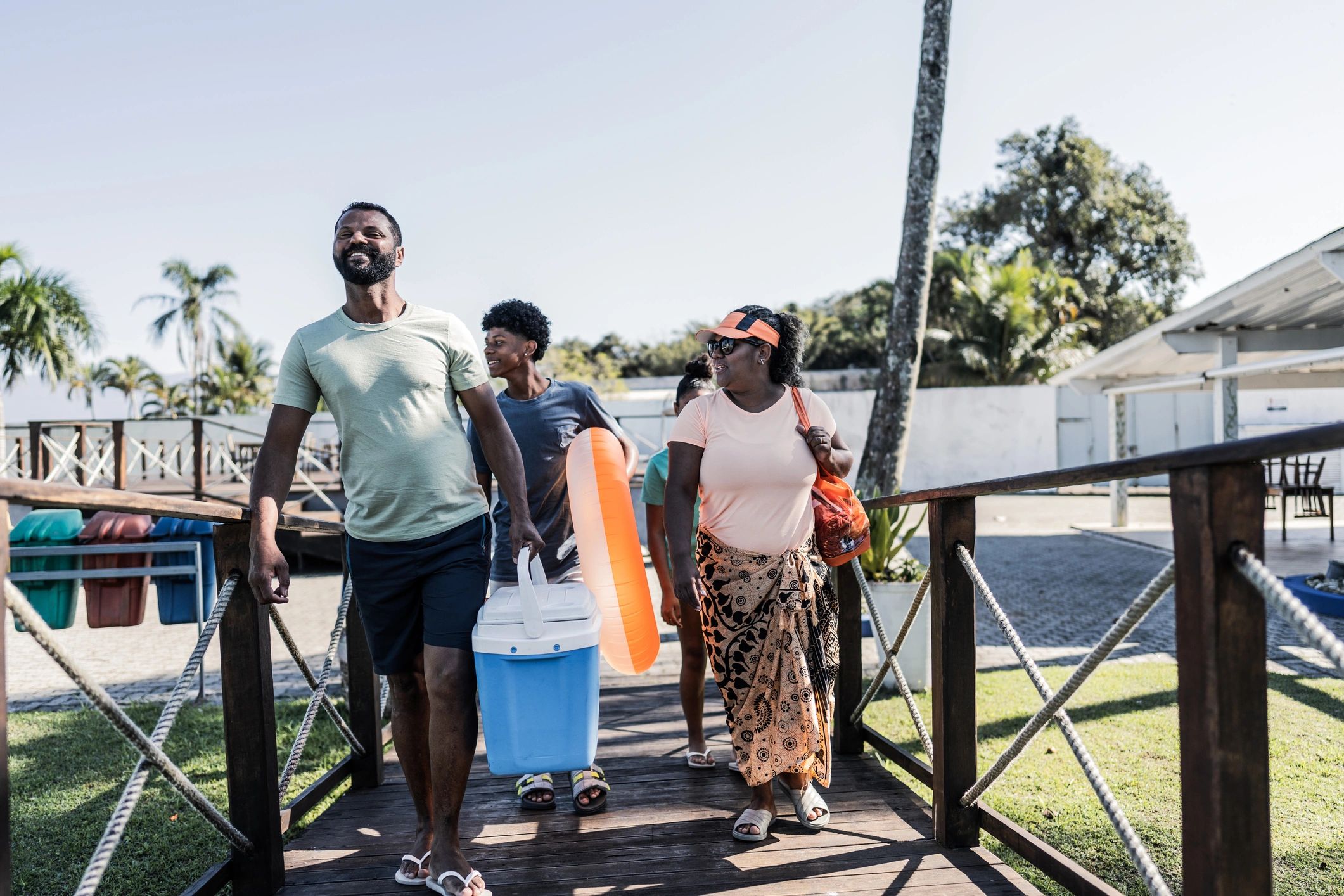 Guests walking along a marina dock